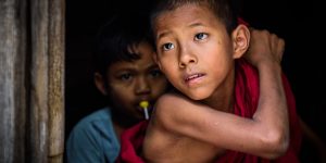 a-young-novice-looking-out-yangon-myanmar