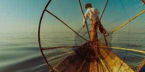 a-local-fisherman-on-his-boat-in-inle-lake