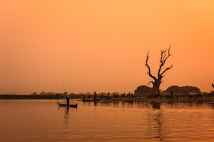 a lonely boatman at sunset - Gatsby