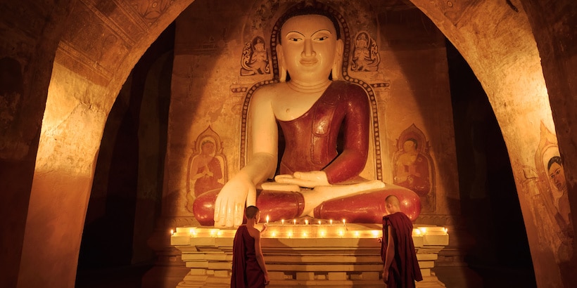 monks in front of a buddha image monks-in-front-of-a-buddha-image