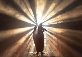 Monks In Light Rays in an Ancient Temple, Bagan Myanmar